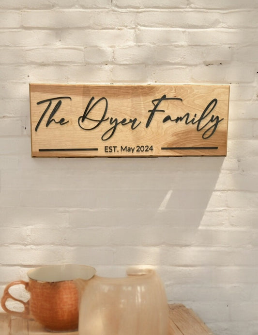 A beautifully crafted wooden sign featuring the family name sign or EST. sign in elegant script